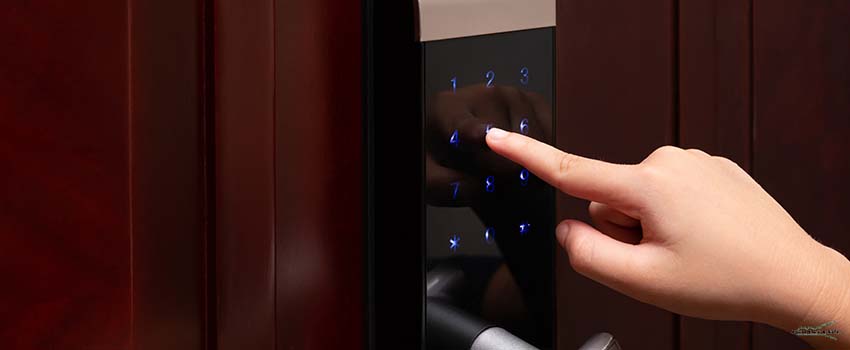 ALS-Kid inputing passwords on electronic door lock