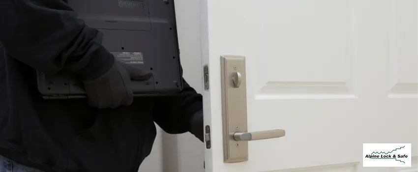 Burglar breaking through a white door
