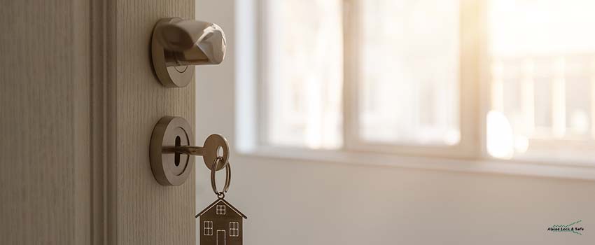 Open door to a new home with key
